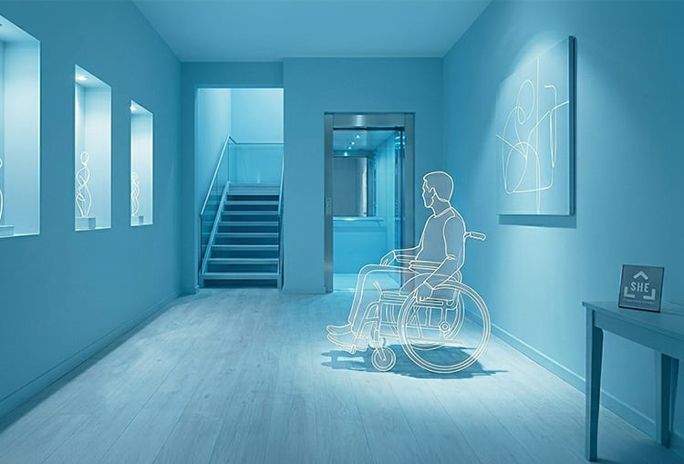 Home adaptation for people with care and support needs 2 Person in a wheelchair moving through a wide, adapted hallway with direct access to a home elevator