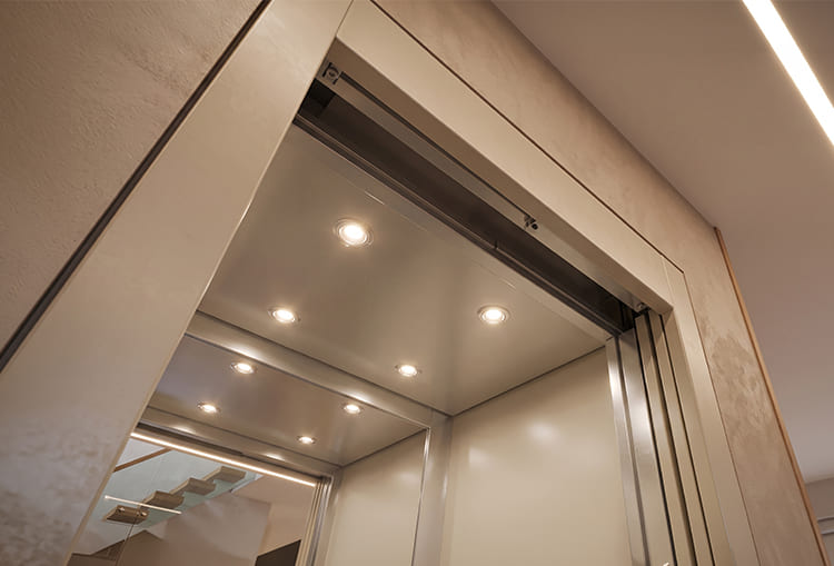 How to save electricity and reduce your home lift energy bill 2 Interior ceiling of a home elevator cabin equipped with efficient recessed LED lights and ambient lighting